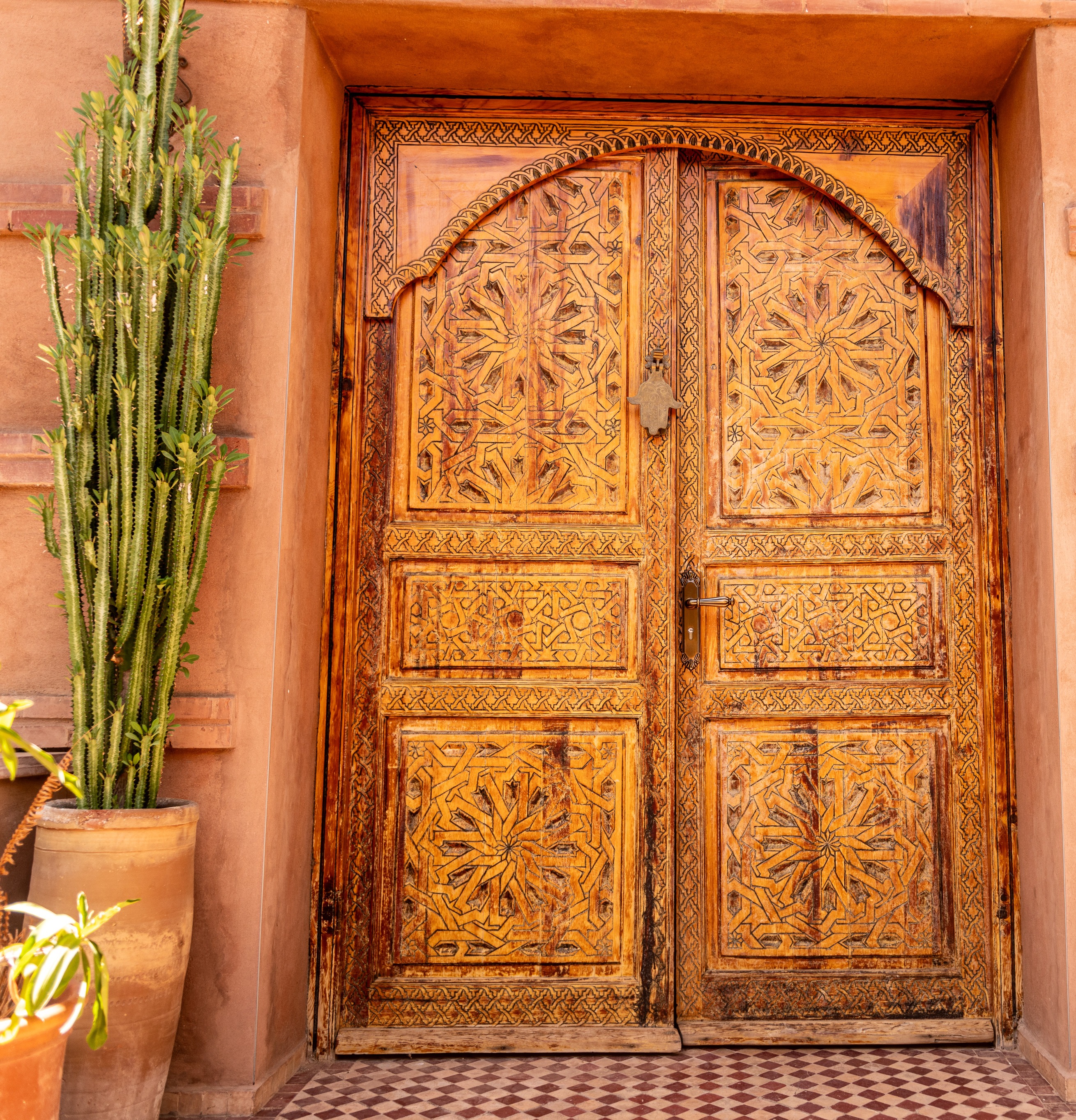 Traditional Moroccan carved wooden door with geometric patterns